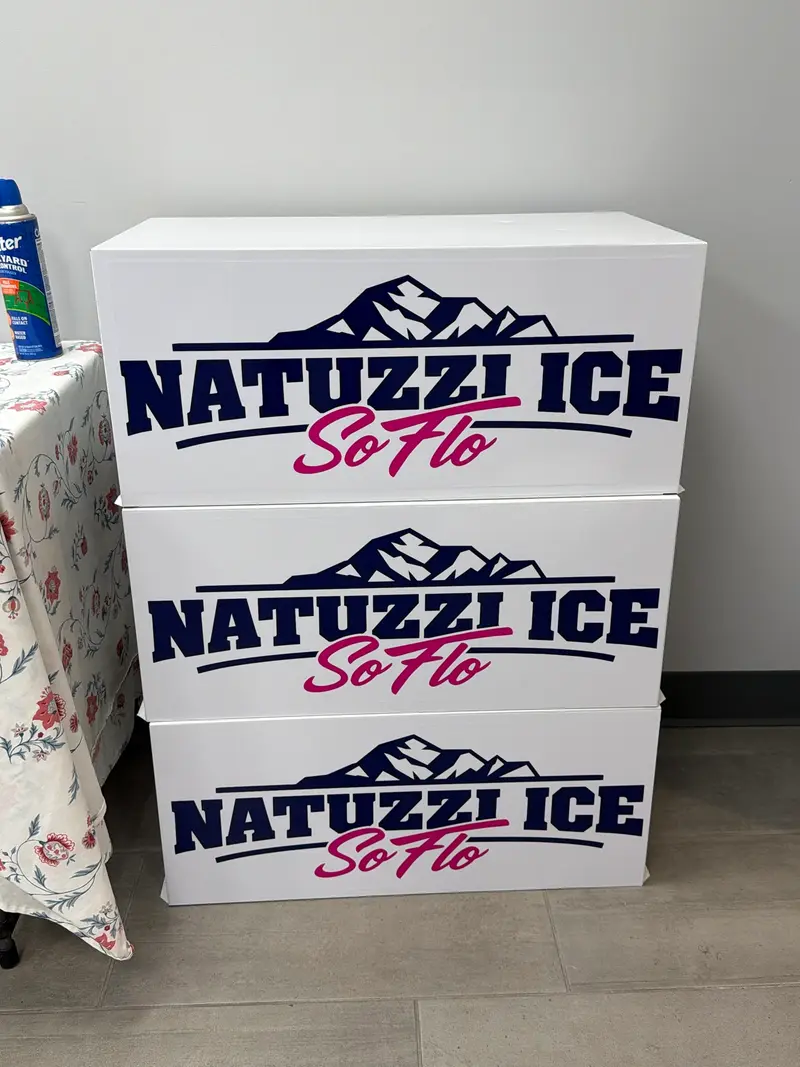 Three Natuzzi Ice SoFlo signs stacked against a wall